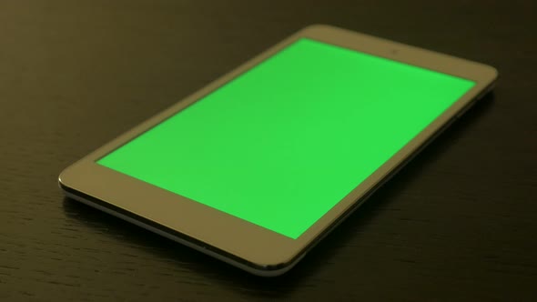 Green screen display on tablet PC shallow DOF 4K 2160p UHD footage - Tablet PC with green screen dis