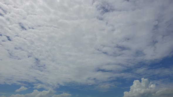 Time lapse of white cloud moving pass around sky background