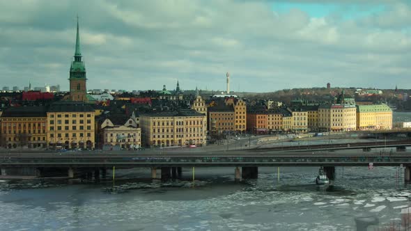 TIMELAPSE view towards the old part of Stockholm, an ice breaking boat foreground