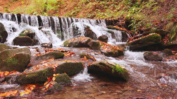 Large Boulders Overgrown with Moss at Waterfall