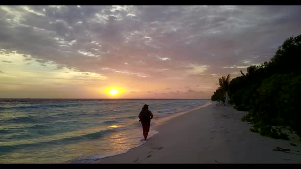 Lady alone suntans on tropical bay beach holiday by blue water and white sandy background of the Mal