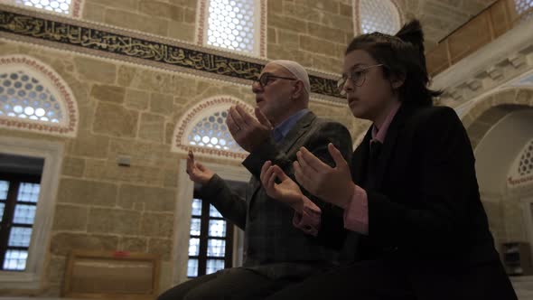 Family Praying Inside Mosque