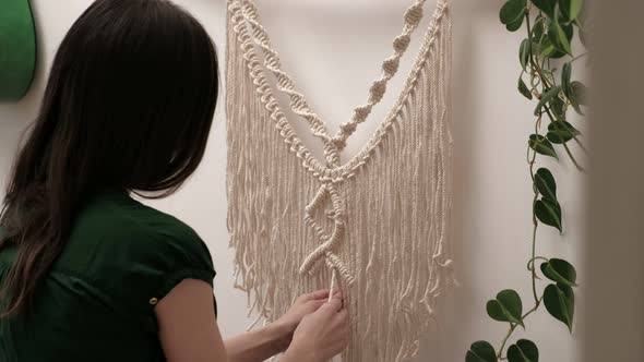 Woman Weaves Macrame on a Stick