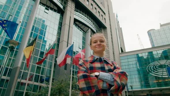 Portrait of Woman with European Flags Near EU Parliament in Brussels Belgium