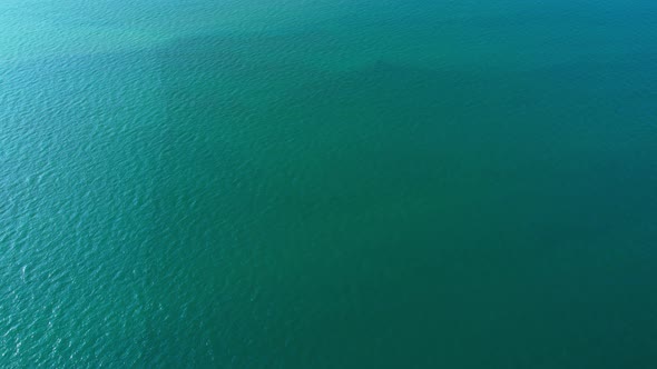 4K Aerial view of drone move on beautiful sea. Flight over ocean, open sea.