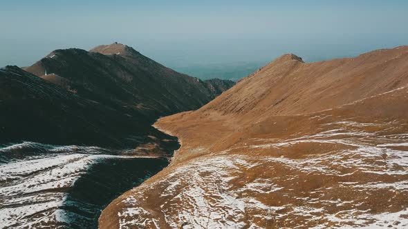 Autumn Mountains Covered with Snow in Places