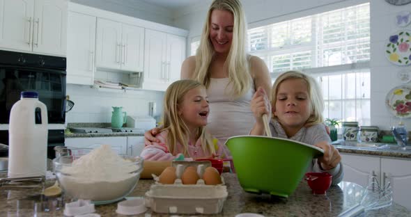 Family making Christmas cookies at home 4k