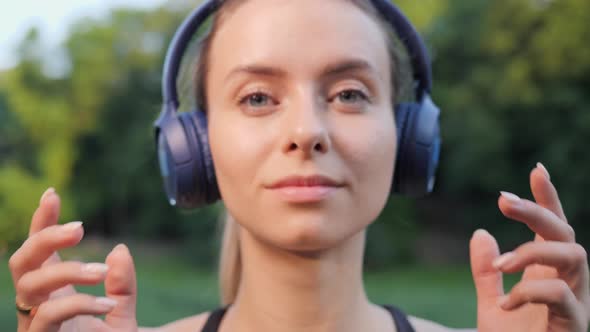 Athlete Takes Off Headphones After Listening to Music Woman Motivation Freedom