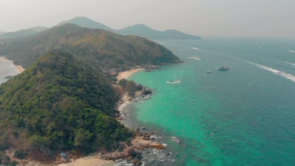 Green Hilly Island Surrounded By Boundless Azure Ocean