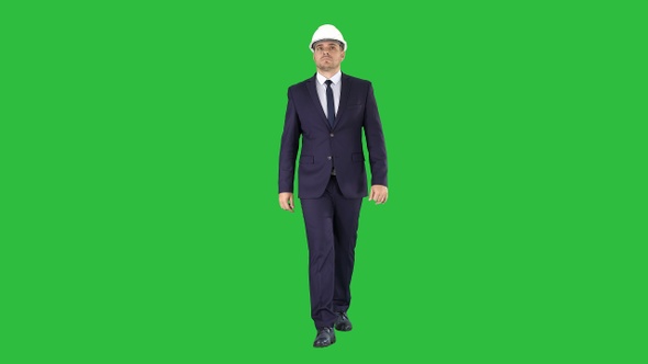 Construction Worker in A Suit Putting on Helmet Safety