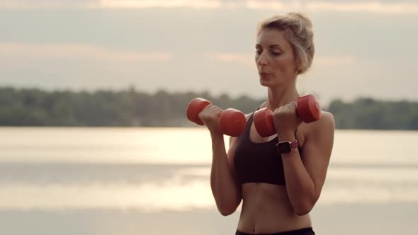 Fitness Dumbbells Exercising. Woman Fitness Workout. Fit Athletic Girl In Sportwear Training.