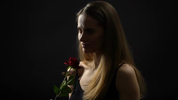 Smiling Woman Holding Red Rose, Romantic Symbol and Femininity, Valentines Day