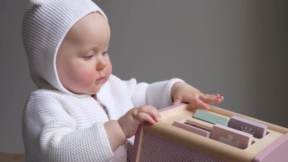 Cute Baby Girl Playing with Toy.