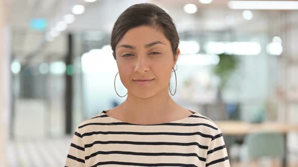 Portrait of Serious Indian Woman Looking at Camera 