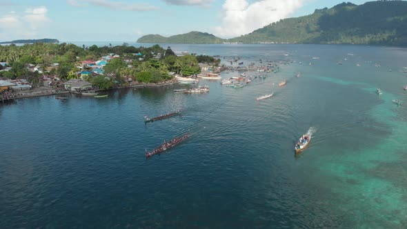 Aerial: kora-kora traditional canoe annual race in Banda Neira in Indonesia