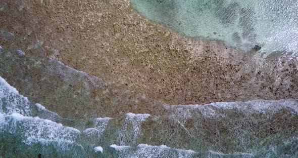 Luxury aerial abstract shot of a white sand paradise beach and turquoise sea background in colourful