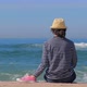 Woman in Striped Shirt at the Beach Enjoying Ocean View - VideoHive Item for Sale