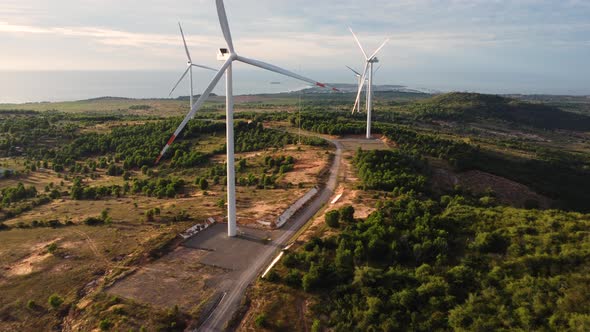 Aerial, wind turbines that are not spinning on a hill. Concept of renewable sustainable green energy