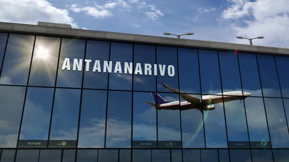 Airplane landing at Antananarivo Madagascar airport mirrored in terminal