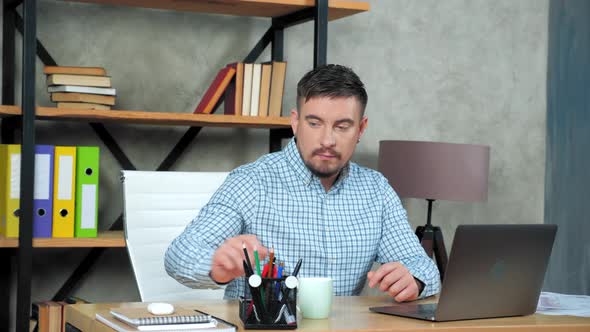 Businessman looking at laptop screen connects to online video call meeting