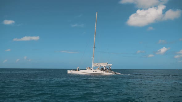 A Sailboat Catamaran on the Horizon in the Beautiful Caribbean Sea