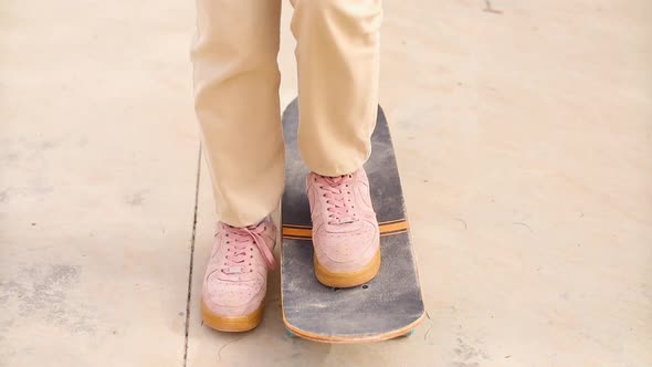 Teenager Riding on Skateboard in a Skatepark