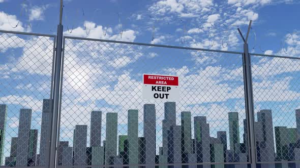 Moving Along Barbed Fence with Restricted Area Sign and Big City on Background