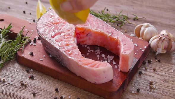 Raw, Fresh Salmon Steak on a Slate Board and Spices Around. Healthy Food Concept