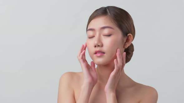 facial beauty skin concept asian female attractive and healthy skin closeup hand touch softy face