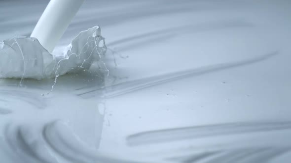 Pouring white paint, Slow Motion