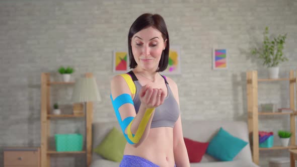 Portrait Beautiful Young Female Athlete Posing Colorful Kinesiotape on Hand