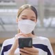 casual lifestyle technology,asian female woman wear facemask walking happiness outdoor - VideoHive Item for Sale