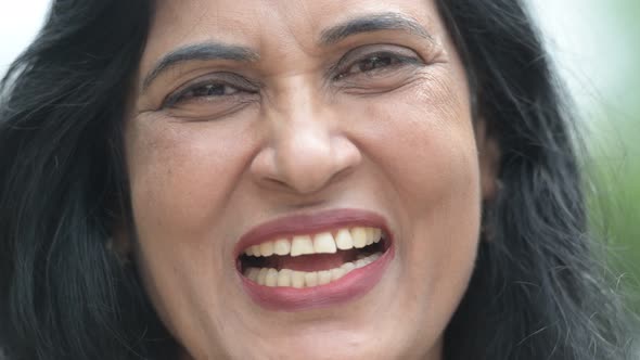 Close Up Shot of Mature Happy Beautiful Indian Woman Smiling in the Streets Outdoors