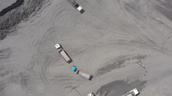 Aerial view open method of mining of coal, anthracite, whales, quarry dump trucks