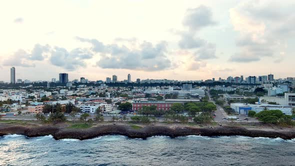 Malecon on cloudy day. Santo Domingo in Dominican Republic. Aerial sideways