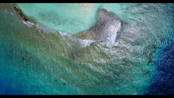 Aerial panorama of luxury coast beach lifestyle by shallow lagoon with clean sand background of a da