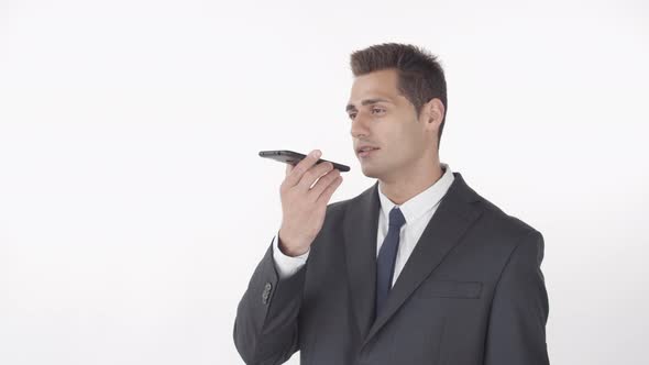 Handsome Businessman Recording Voice Message
