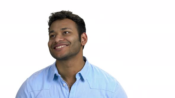 Happy Thoughtful Indian Man Looking Up