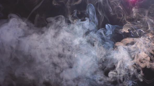 Smoke on Black Background in Blue Light