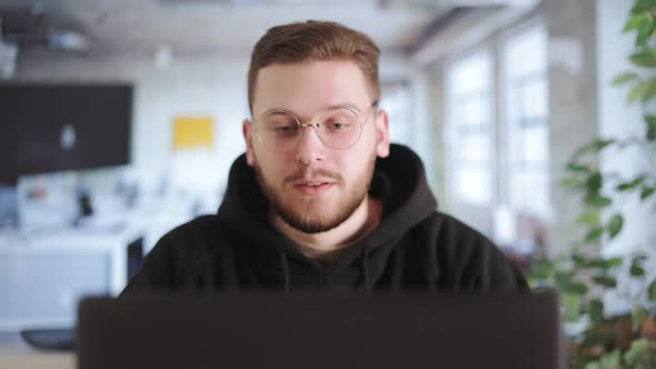 Worker on Video Call in Office