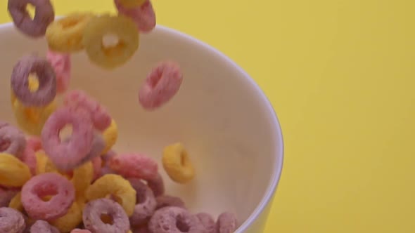 Bowl with Multicolored Cornflakes Slowmotion