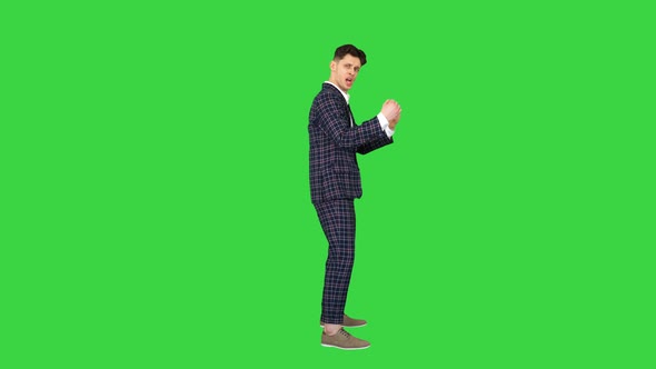 Cool Attractive Businessman Does Different Defiant Gestures on a Green Screen, Chroma Key