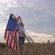 Happy Patriotic Young Woman Waves the US Flag and Jumps Into the Field - VideoHive Item for Sale