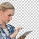Portrait of a young woman using a tablet, Alpha Channel - VideoHive Item for Sale