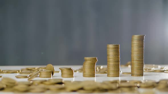 Coins Fall on the Table in Slow Motion