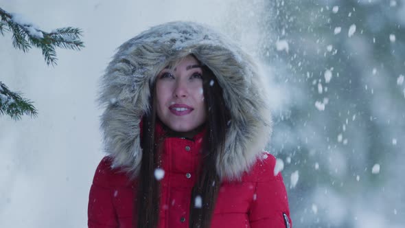 Girl under falling snow