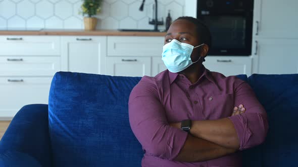 Upset Man with a Confirmed Viral Disease Wearing Medical Mask Feels Sad