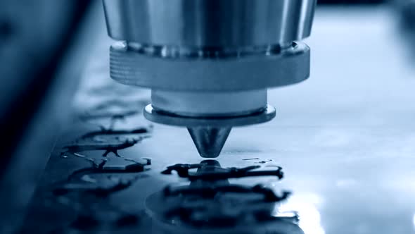 A Laser Beam Cuts the Sheet Metal in the Manufacture