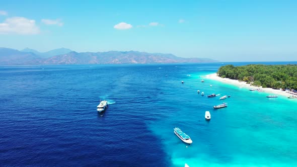 Aerial above texture of beautiful shore beach time by turquoise ocean with white sandy background of