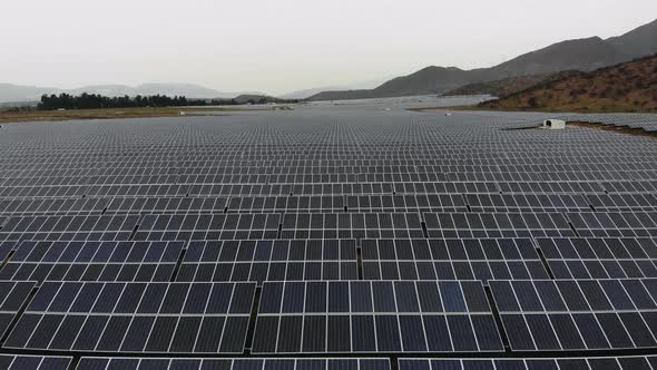 Aerial Drone Shot over giant Photovoltaic plant on a cloudy day, Chile-4K